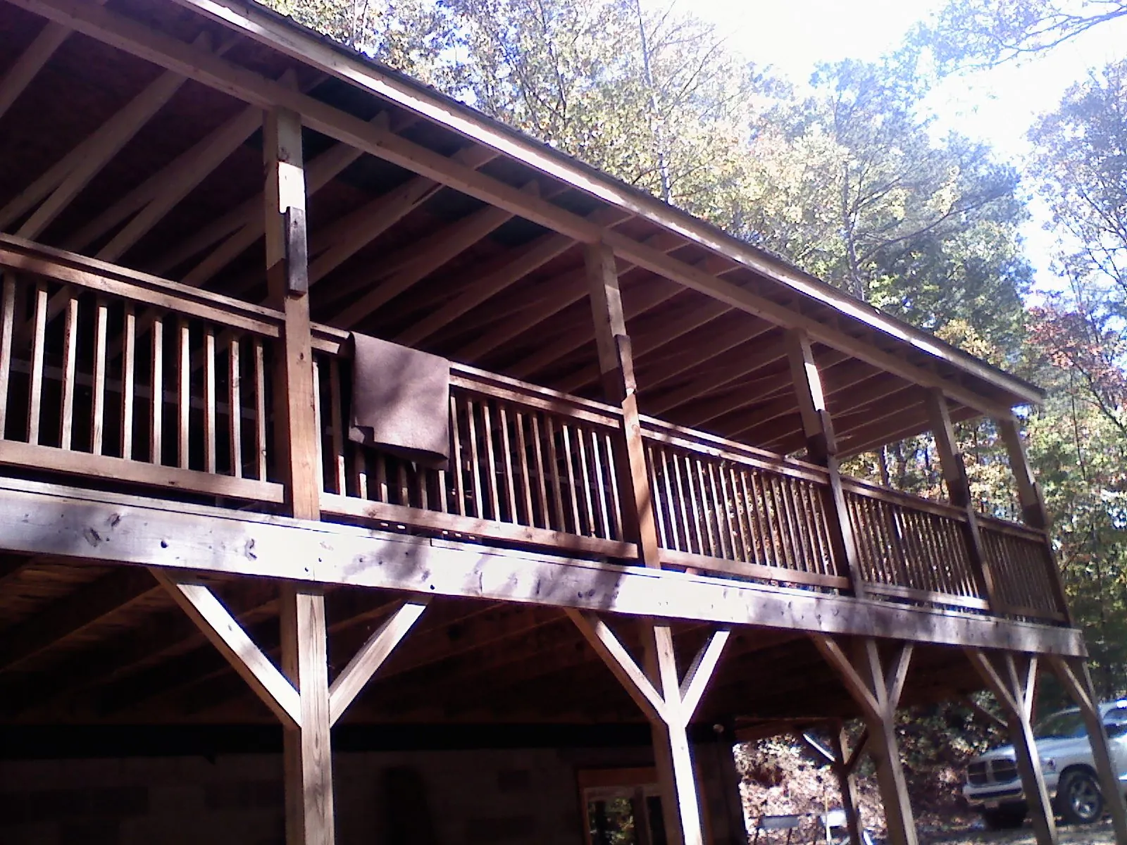 Timber framing under a new elevated porch and deck — Roof Leak Repair in New Woodstock by Roofing Brothers